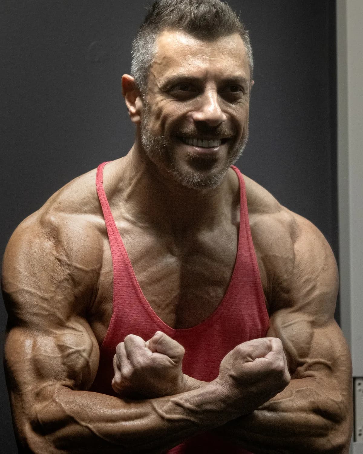 Solo portrait in a red training vest.